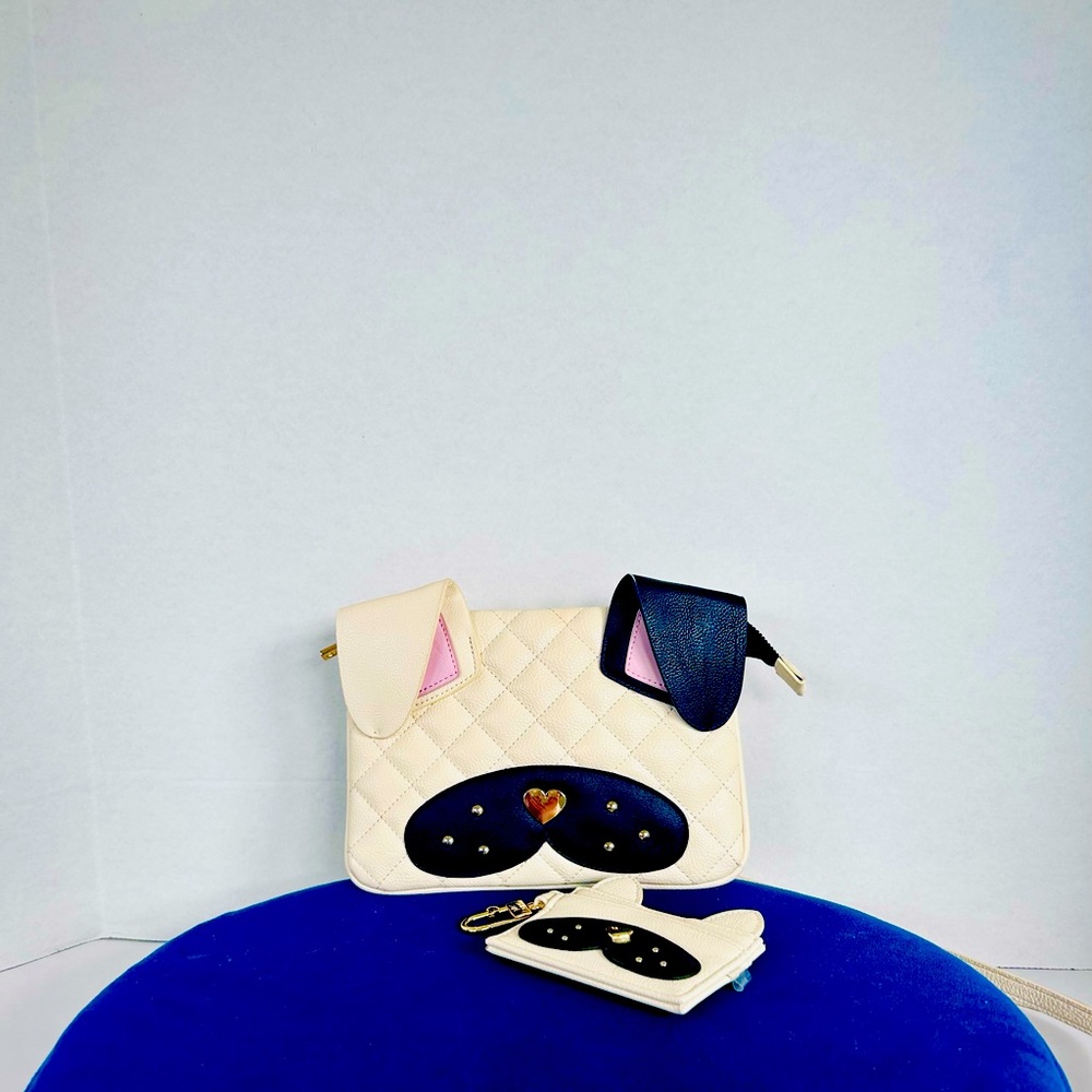 Gently used Betsy Johnson purse with wallet. Used once. Very cute puppy design